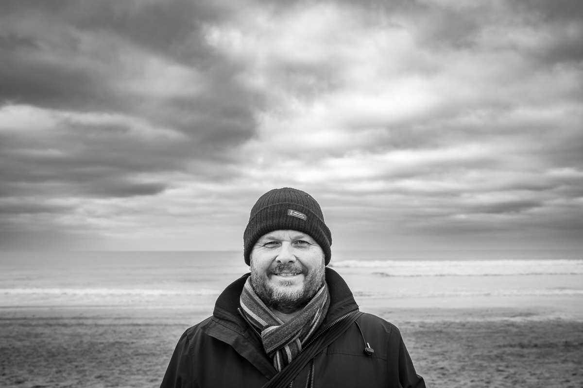 The Beach in Winter - Man with Hat, coast and scarf - black and white